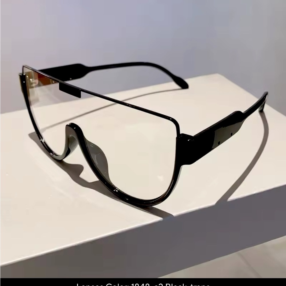 Black oversized square sunglasses with metal frame and thin temple arms